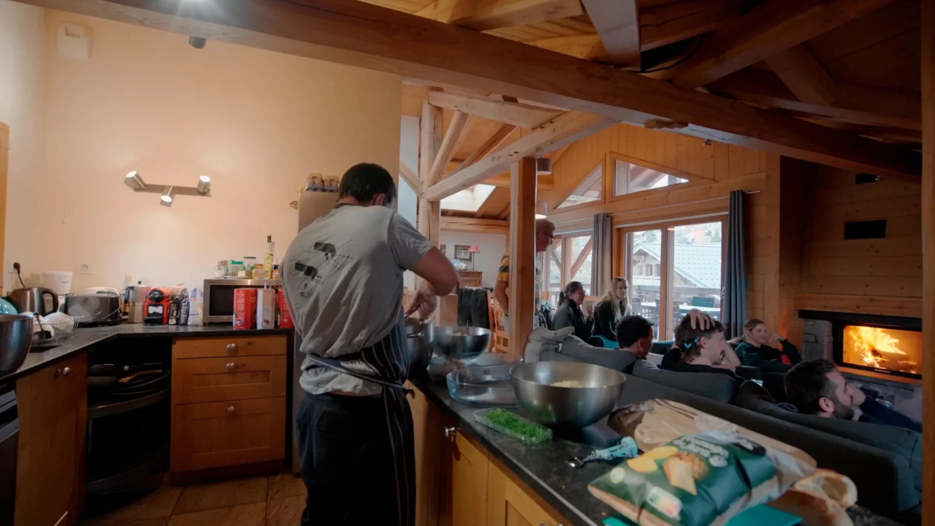 Chalet kitchen with chef and guests
